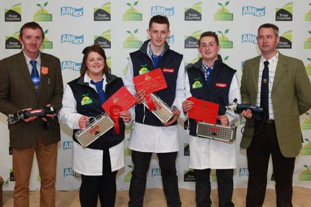 Judges Pat Greany (Left) and Jonathan Long flank the winning team of Blue Texel Breeders Angharad Francis, Rhys Francis and Chris Davies